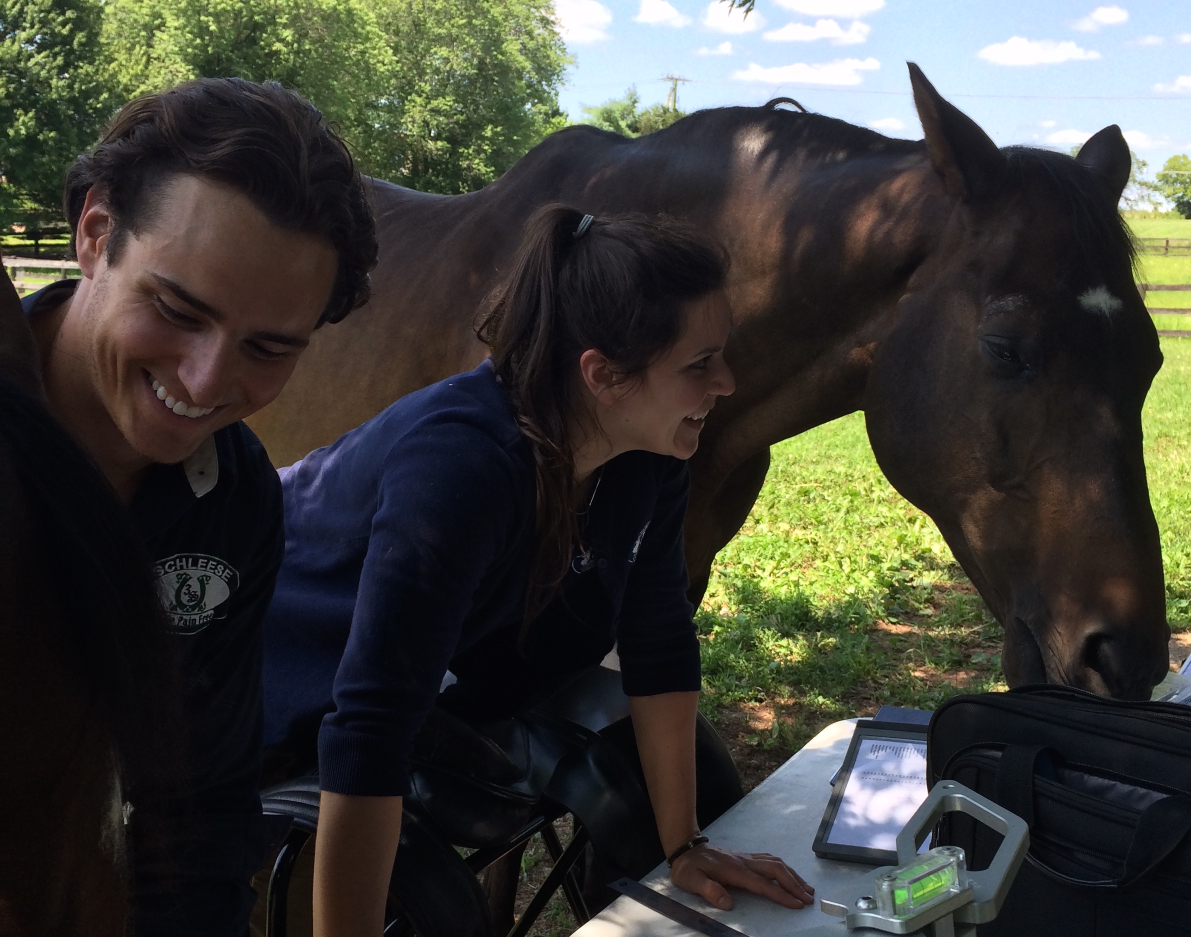 Aaron Backx-SFT & Alexa Frye-CSM doing what they do best - Helping Horses!